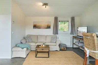 Ein Sitzbereich in der Unterkunft Süsel Seeparx Ferienhaus Seezeit
