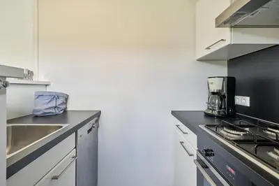 Küche/Küchenzeile in der Unterkunft Süsel Seeparx Ferienhaus Seeflüstern
