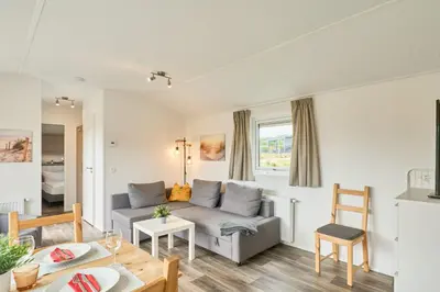 Ein Sitzbereich in der Unterkunft Süsel Seeparx Ferienhaus Seehafen
