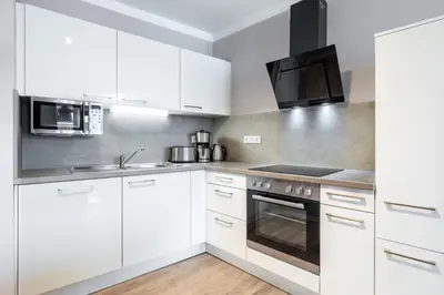 Küche/Küchenzeile in der Unterkunft Godewindpark Deluxe-Suite 1-17 mit West-Loggia