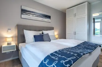 Ein Bett oder Betten in einem Zimmer der Unterkunft Godewindpark Exklusives Apartment 3-08