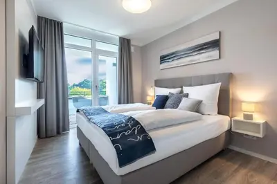 Ein Bett oder Betten in einem Zimmer der Unterkunft Godewindpark Exklusives Apartment 3-08