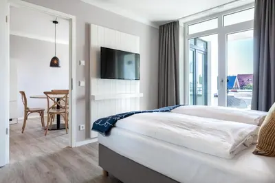 Ein Bett oder Betten in einem Zimmer der Unterkunft Godewindpark Deluxe-Suite 2-15