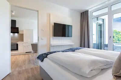 Ein Bett oder Betten in einem Zimmer der Unterkunft Godewindpark Deluxe-Apartment 2-16
