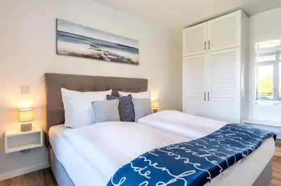 Ein Bett oder Betten in einem Zimmer der Unterkunft Godewindpark Deluxe-Apartment 2-16