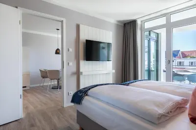Ein Bett oder Betten in einem Zimmer der Unterkunft Godewindpark Deluxe-Suite 1-15