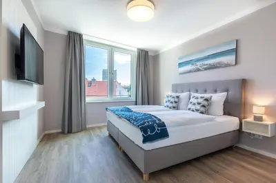Ein Bett oder Betten in einem Zimmer der Unterkunft Godewindpark Exklusivsuite 3-18