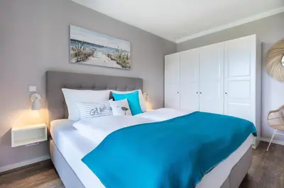 Ein Bett oder Betten in einem Zimmer der Unterkunft Godewindpark Exklusives Apartment 3-16