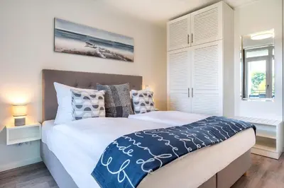 Ein Bett oder Betten in einem Zimmer der Unterkunft Godewindpark Deluxe-Apartment 2-04