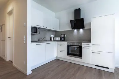 Küche/Küchenzeile in der Unterkunft Godewindpark Deluxe-Apartment 2-11