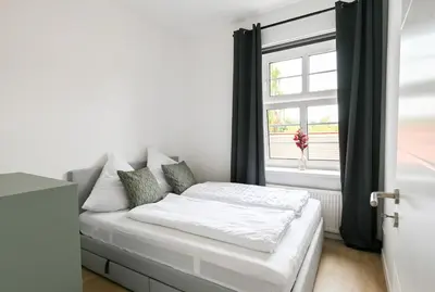 Ein Bett oder Betten in einem Zimmer der Unterkunft Charmante 2-Zimmer-Wohnung am Wasser & Altstadt