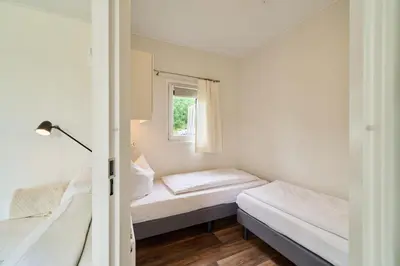 Ein Bett oder Betten in einem Zimmer der Unterkunft Süsel Seeparx Tinyhouse Ostsee