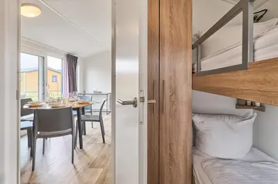 Ein Bett oder Betten in einem Zimmer der Unterkunft Süsel Seeparx Ferienhaus Ankerplatz