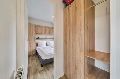 Ein Bett oder Betten in einem Zimmer der Unterkunft Süsel Seeparx Ferienhaus Ankerplatz