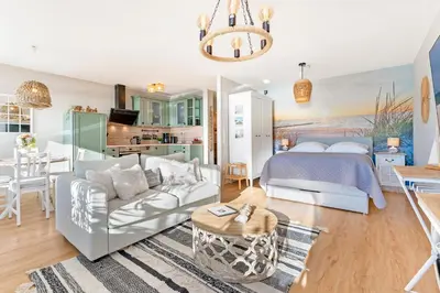 Ein Bett oder Betten in einem Zimmer der Unterkunft Panoramic Loft mit Meerblick