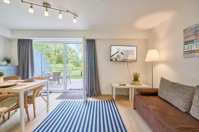 Ein Sitzbereich in der Unterkunft Süsel Seeparx Ferienwohnung Seeblick