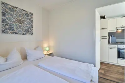 Küche/Küchenzeile in der Unterkunft Süsel Seeparx Ferienhaus Wellenzauber