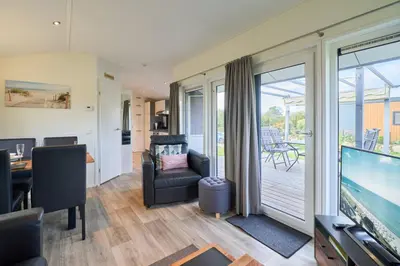 Ein Sitzbereich in der Unterkunft Süsel Seeparx Ferienhaus Seeglück