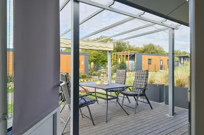 Ein Balkon oder eine Terrasse in der Unterkunft Süsel Seeparx Ferienhaus Seeglück