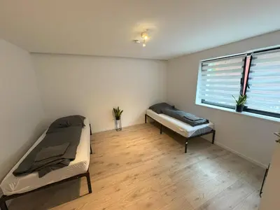 Ein Bett oder Betten in einem Zimmer der Unterkunft Modernes 2 Zimmer Souterrain Apartment - zentral - nahe Hamburg & Lübeck