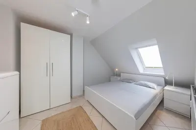Ein Bett oder Betten in einem Zimmer der Unterkunft Heimathafen