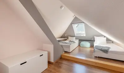 Ein Bett oder Betten in einem Zimmer der Unterkunft 6 East Ferienhaus