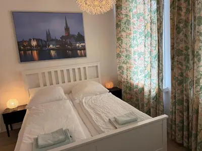Ein Bett oder Betten in einem Zimmer der Unterkunft Pension Am Burgtor