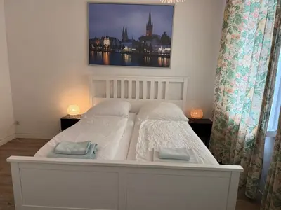 Ein Bett oder Betten in einem Zimmer der Unterkunft Pension Am Burgtor