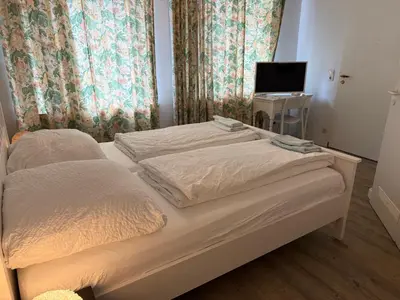Ein Bett oder Betten in einem Zimmer der Unterkunft Pension Am Burgtor