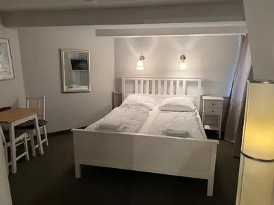 Ein Bett oder Betten in einem Zimmer der Unterkunft Pension Am Burgtor