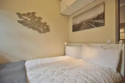 Ein Bett oder Betten in einem Zimmer der Unterkunft Villa Idyll Appartement 11 in der Villa Idyll