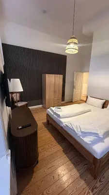 Ein Bett oder Betten in einem Zimmer der Unterkunft Hanse Room Lübeck