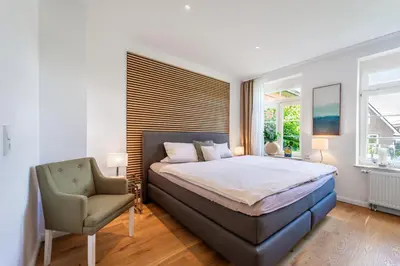 Ein Bett oder Betten in einem Zimmer der Unterkunft Wohlfühlen in Scharbeutz-Gleschendorf Komfort für 4