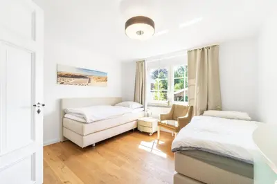 Ein Bett oder Betten in einem Zimmer der Unterkunft Wohlfühlen in Scharbeutz-Gleschendorf Komfort für 4
