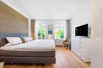 Ein Bett oder Betten in einem Zimmer der Unterkunft Wohlfühlen in Scharbeutz-Gleschendorf Komfort für 4