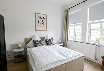 Ein Bett oder Betten in einem Zimmer der Unterkunft Helle 2 Zimmer Altbauwohnung in Lübecks Altstadt