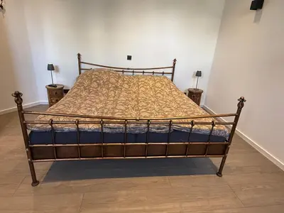 Ein Bett oder Betten in einem Zimmer der Unterkunft Müllerstube im historischen Müllerhaus