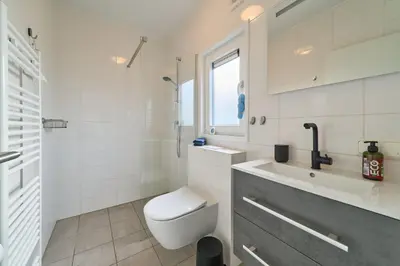 Ein Badezimmer in der Unterkunft Süsel Seeparx Ferienhaus Strandgut 65