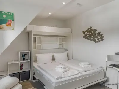 Ein Bett oder Betten in einem Zimmer der Unterkunft Objekt-Nr 54 - Strand - Strandredder