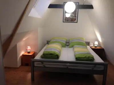 Ein Bett oder Betten in einem Zimmer der Unterkunft Lübecker Ganghausperle
