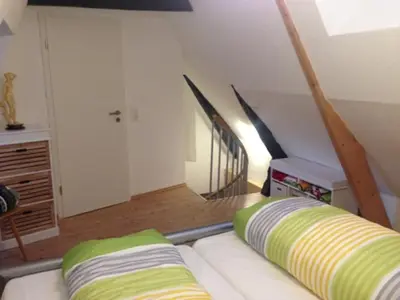 Ein Bett oder Betten in einem Zimmer der Unterkunft Lübecker Ganghausperle