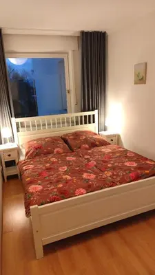 Ein Bett oder Betten in einem Zimmer der Unterkunft Ferienwohnung Timmestrand