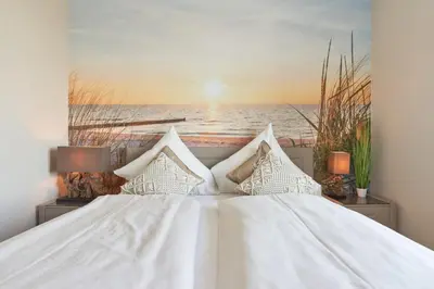 Ein Bett oder Betten in einem Zimmer der Unterkunft Ferienwohnung Ocean House
