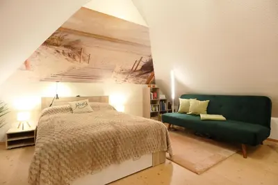 Ein Bett oder Betten in einem Zimmer der Unterkunft Barendorf Padua Ferienwohnung