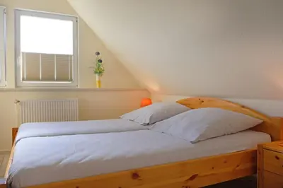 Ein Bett oder Betten in einem Zimmer der Unterkunft Ostseebrise