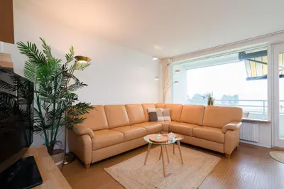 Ein Sitzbereich in der Unterkunft Giny's Beach Appartement