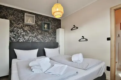 Ein Bett oder Betten in einem Zimmer der Unterkunft Haus Parkallee 1 Alleestrandpark App 14