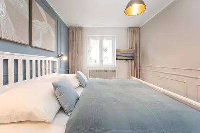 Ein Bett oder Betten in einem Zimmer der Unterkunft Ferienwohnung Sandweiss Ferienwohnung 01