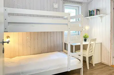 Ein Bett oder Betten in einem Zimmer der Unterkunft Schatzkiste - Dorf Ferienhaus 18