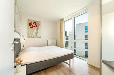 Ein Bett oder Betten in einem Zimmer der Unterkunft Promenadenvilla 03 Wohnung 07